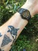 Timex Stealth tilted digital watch with arm orca tattoo.jpeg