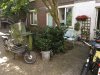 Rapenburg tuin met cargo bike en lounge set.jpeg